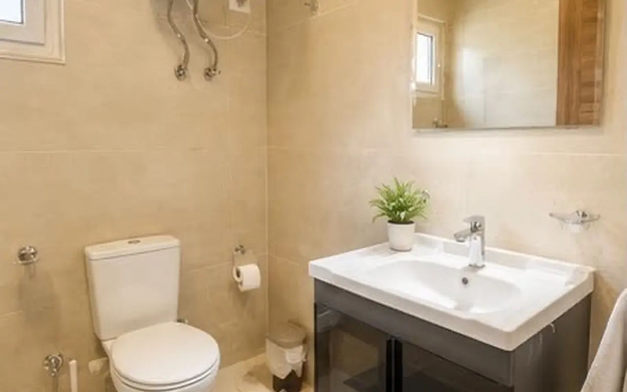 Guest WC with vanity and warm neutral tiling