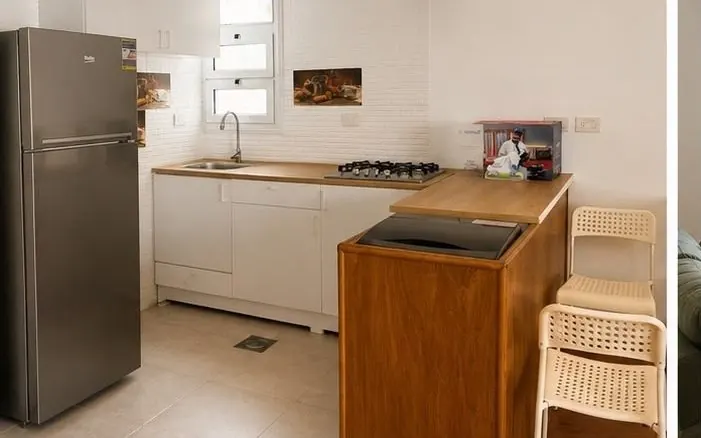Kitchen with breakfast bar and full appliances