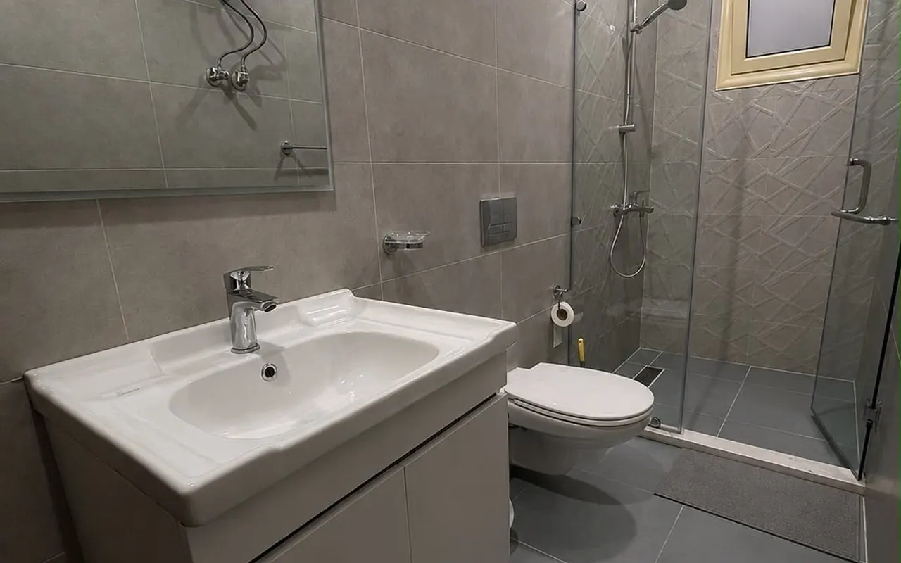 Second bathroom with walk-in shower and floating vanity