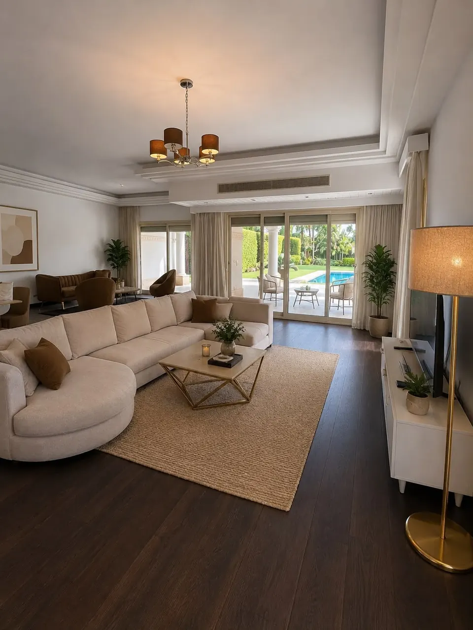 Living room with a curved sectional sofa and garden view